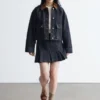Pleated Denim Mini Skirt
