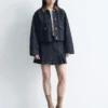 Pleated Denim Mini Skirt